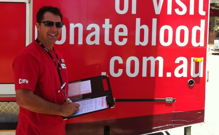 Red Cross Crew Member Dennis Jones eagerly awaiting blood donors.